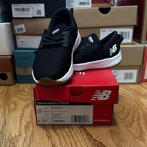 New Balance Kids Black and White Slip-On Sneakers